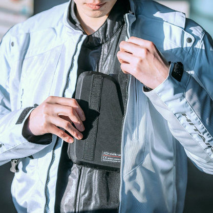 Individual fitting the CE-certified Hit Air ASC protective padding in a jacket.