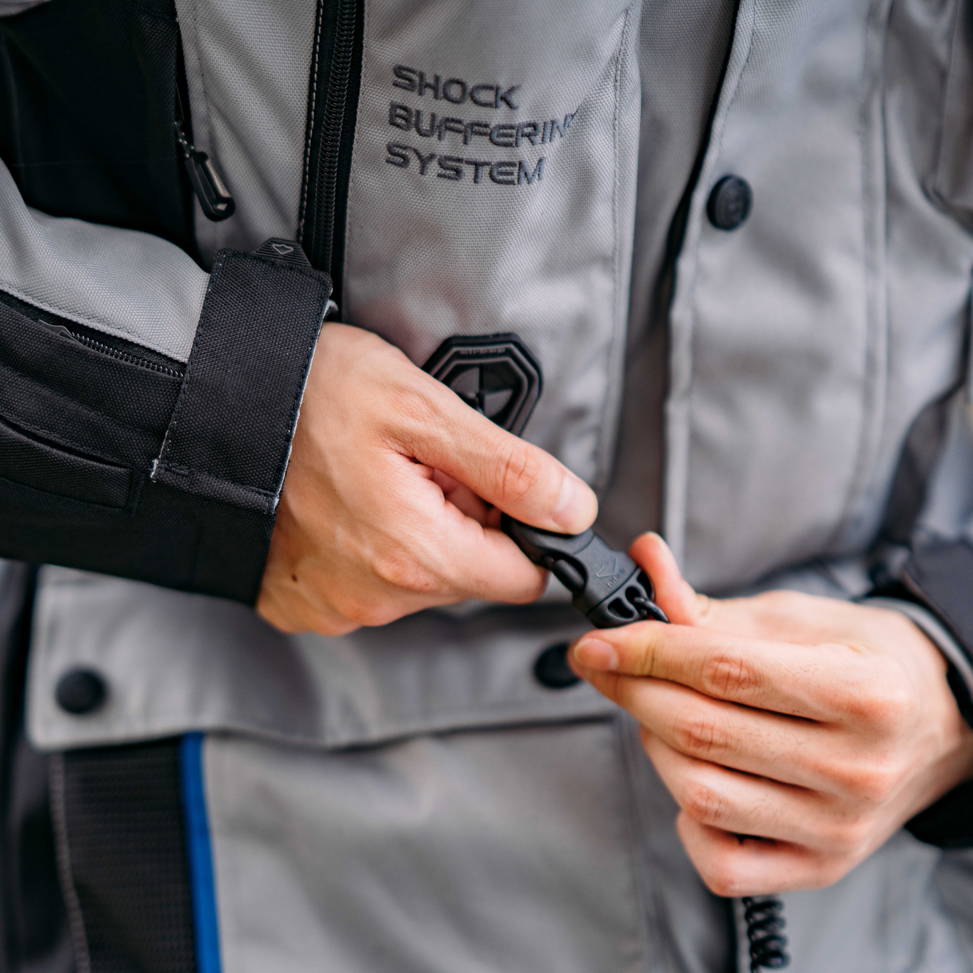 An individual connecting a keyball and lanyard on a Hit Air Shock Buffering System.
