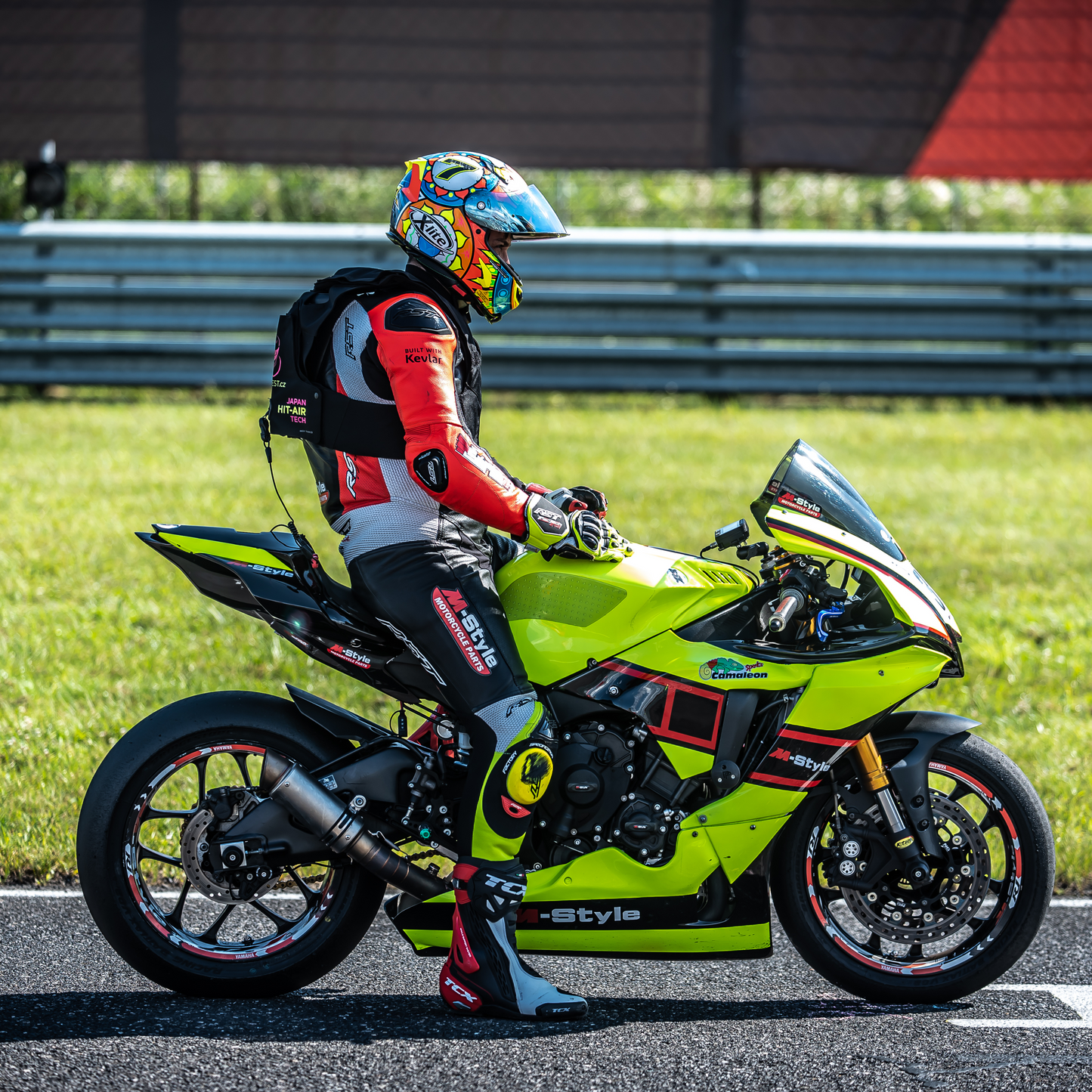 Motorcyclist in Hit Air RS1 racing gear at the start line.