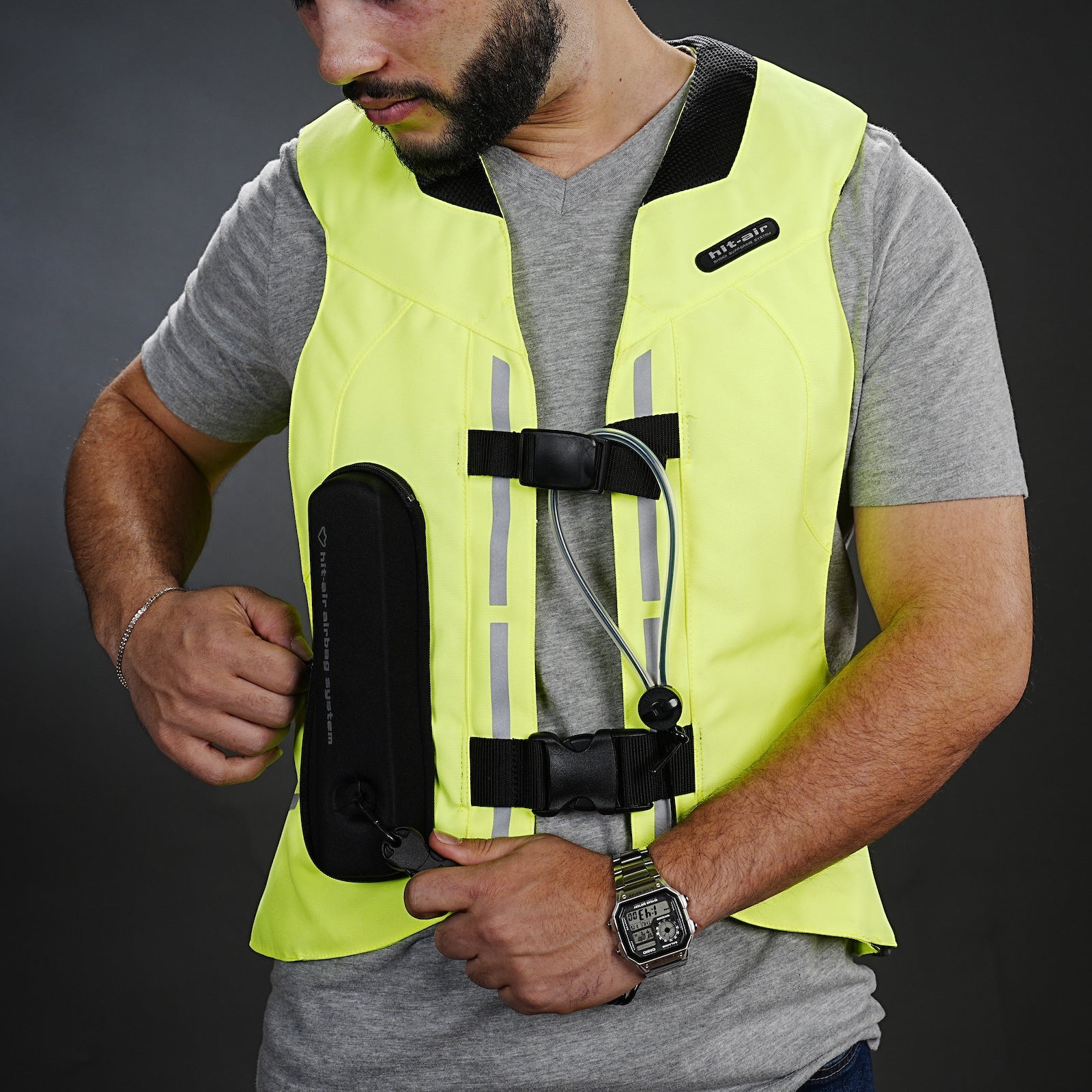 ST high-visibility safety vest close up key box housing dark background