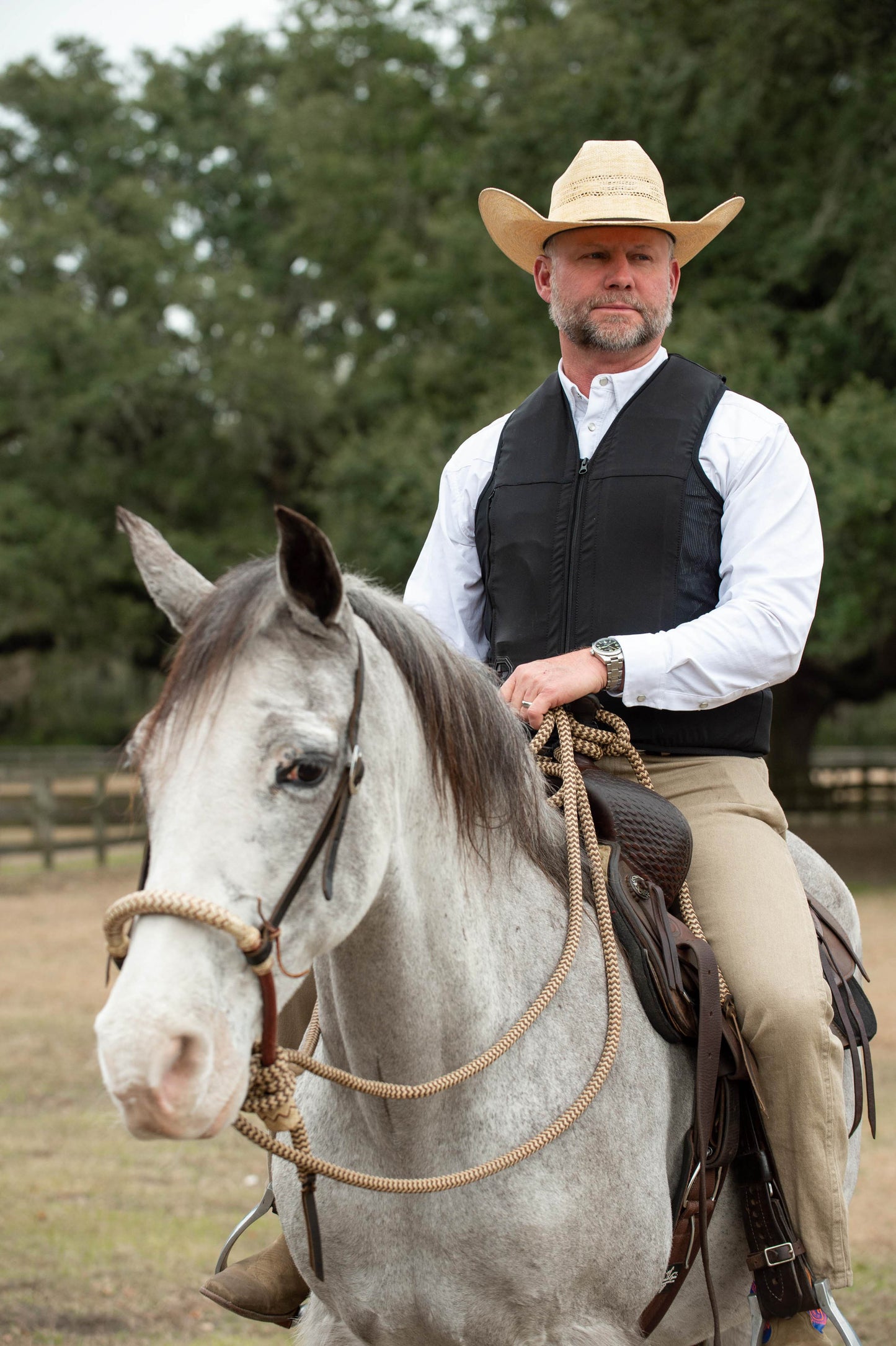 A western equestrian on a horse wearing a Hit Air inflatable airbag system. 