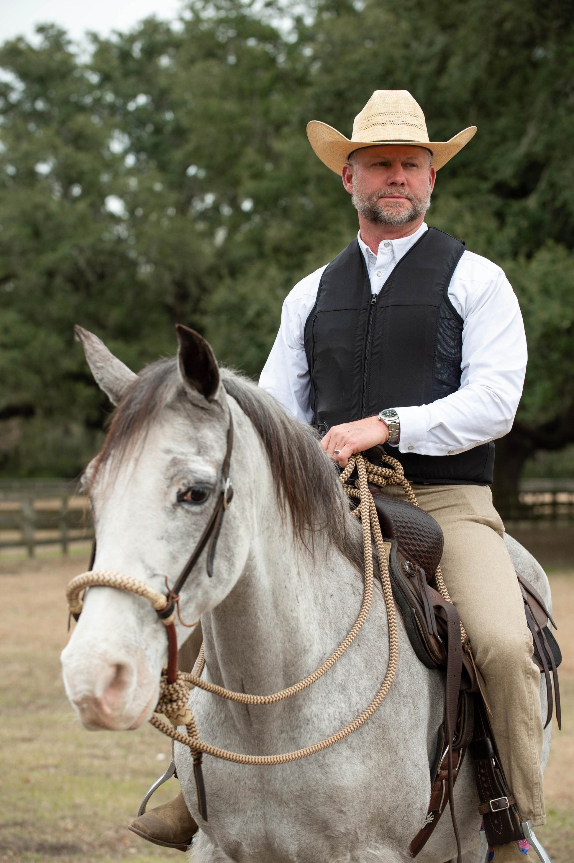 A western equestrian on a horse wearing a Hit Air inflatable airbag system. 